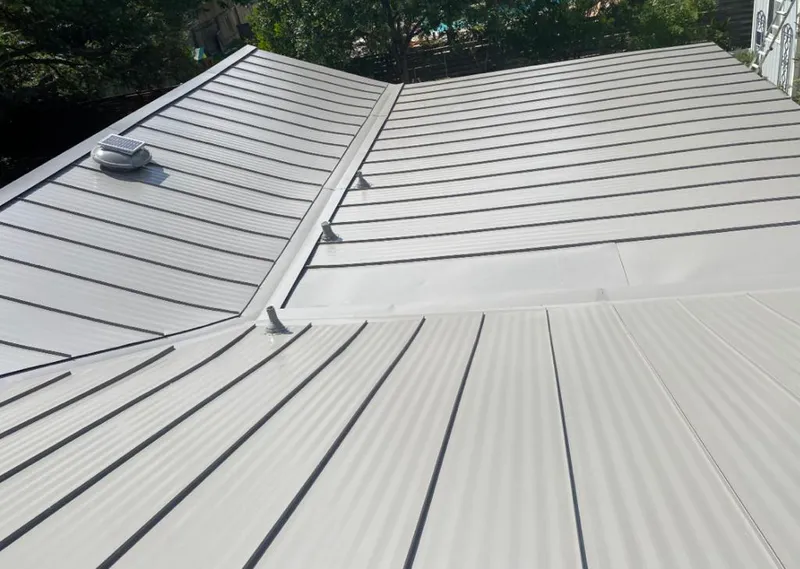 Solar attic fan installed on a metal roof for Roof Ventilation in Solvang